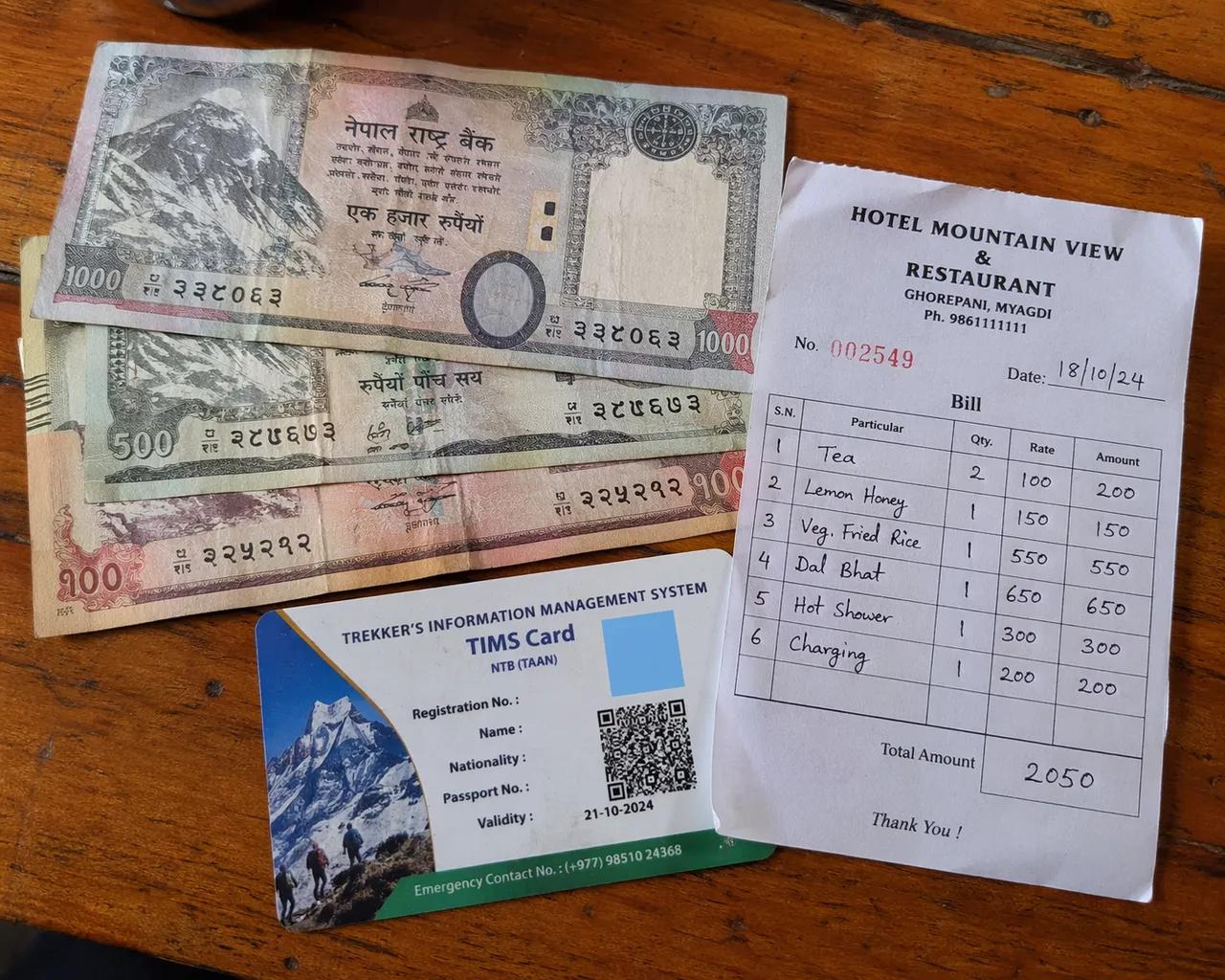 Nepali rupee notes and trekking permits for the Annapurna Base Camp trek cost reference